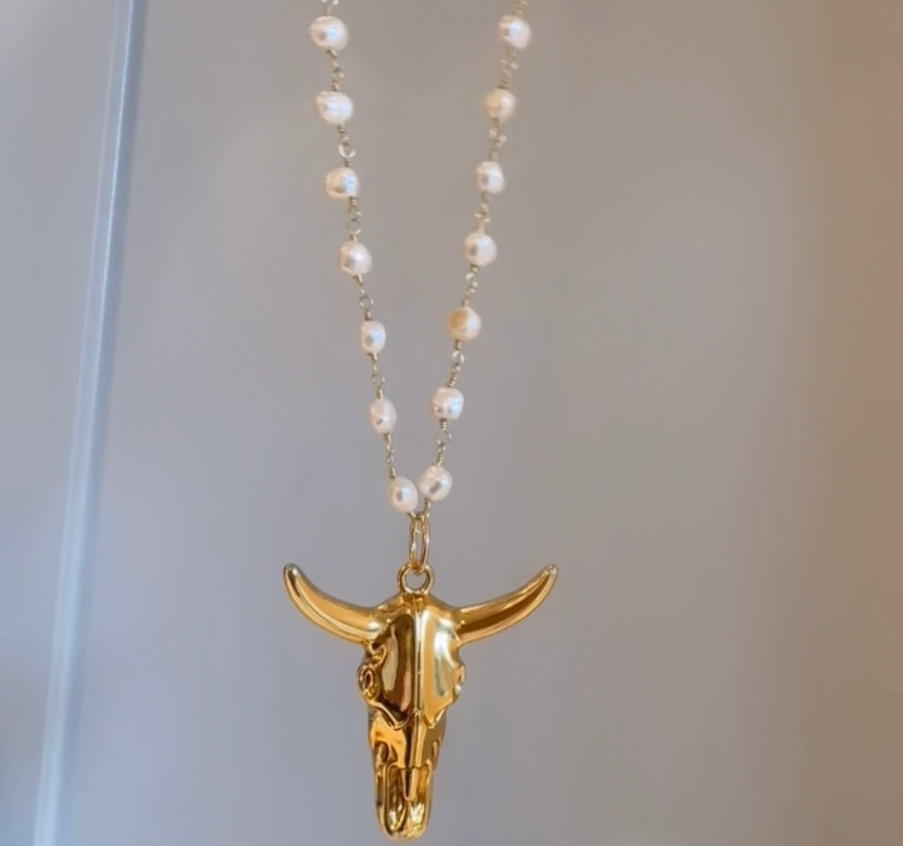 Bull pendant on pearl chain or paperclip chain