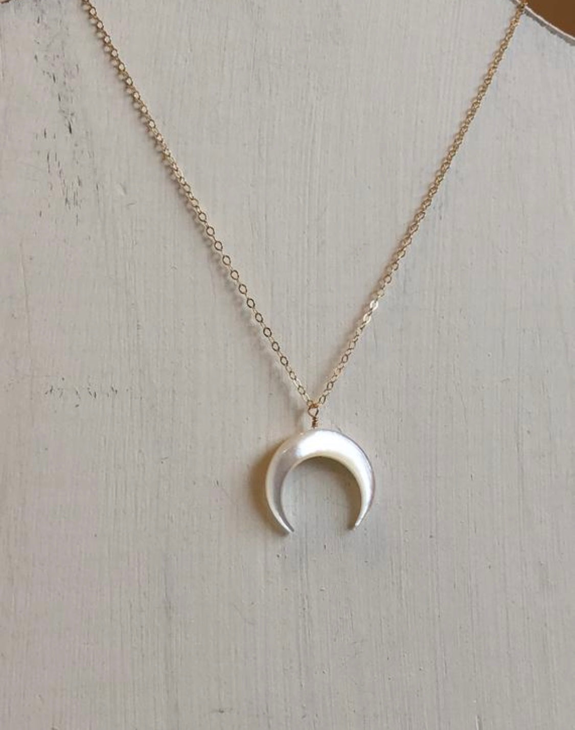 Crescent pearl necklace